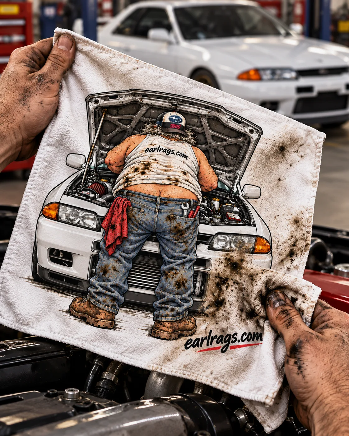 Greasy hands holding an Earl Rag featuring a white JDM coupe